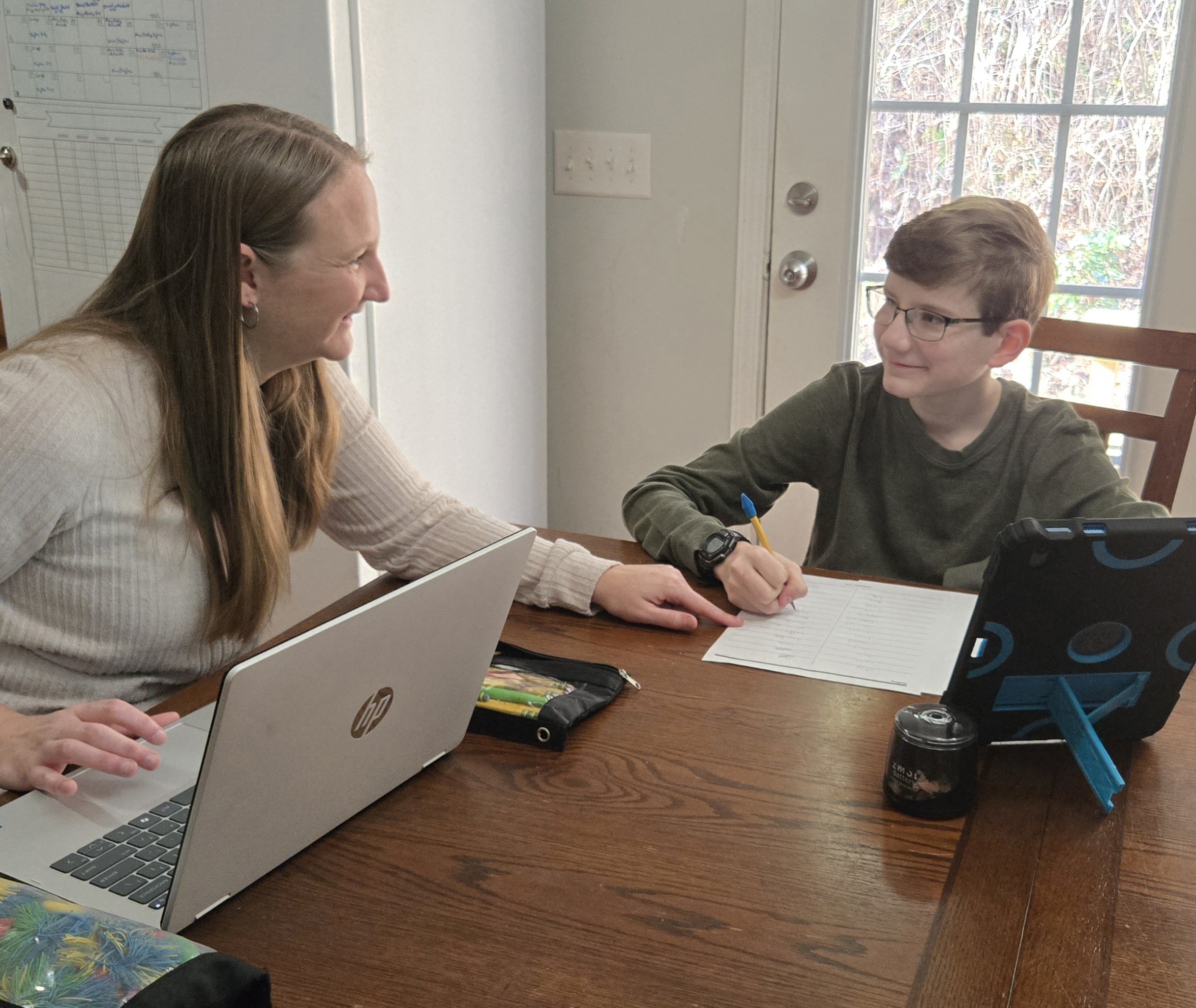 Parent helping child with schoolwork